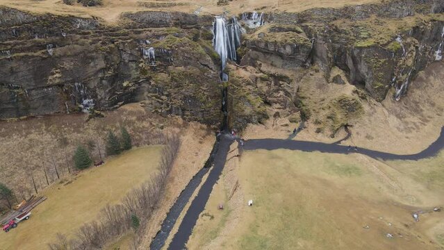Aerial shot of Gljufrabui, next to Seljlandsfoss in Iceland. Large view showing visitors
