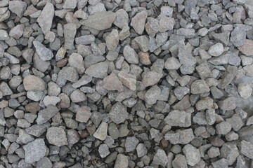 gray gravel texture background beside the house, close up view from  the top.
