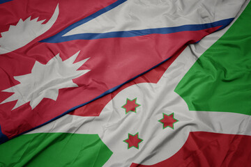 waving colorful flag of burundi and national flag of nepal.