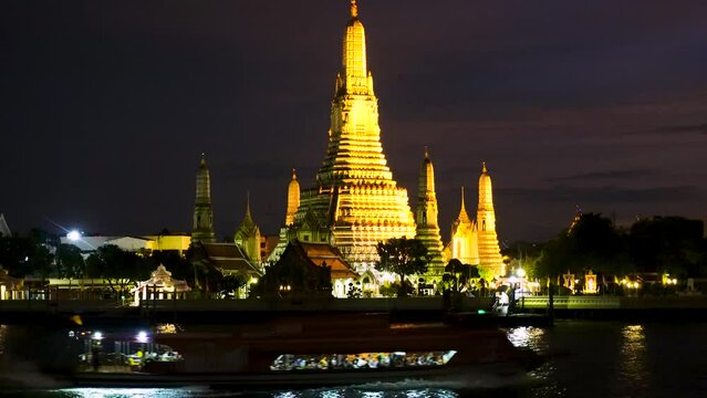 Magical tropical night sky over the Wat Arun Ratchawararam Ratchawaramahawihan, Temple of Dawn.  A Buddhist temple in the Bangkok Yai district of Bangkok, Thailand,  The most famous temple in Bangkok