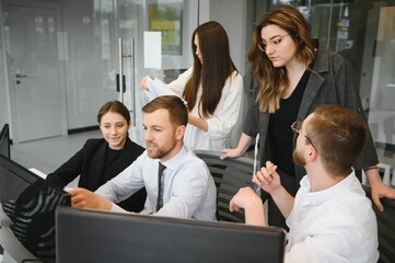 Corporate business team and manager in a meeting room at modern office with panoramic windows. Business concept