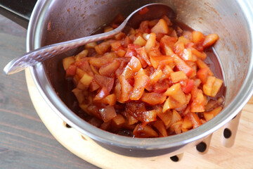 Pot of freshly cooked caramelized homemade apple compote
