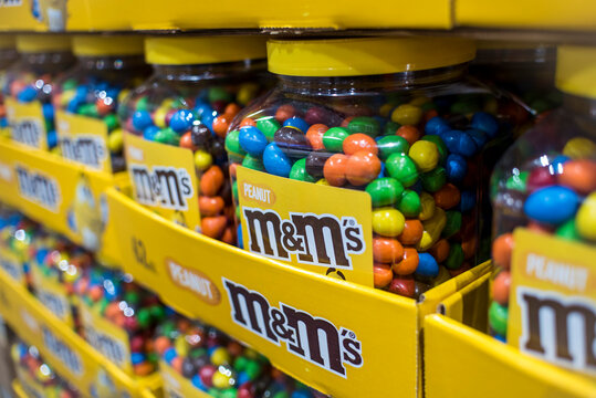 Jars of peanut M&Ms on display and for sale at a hypermarket.