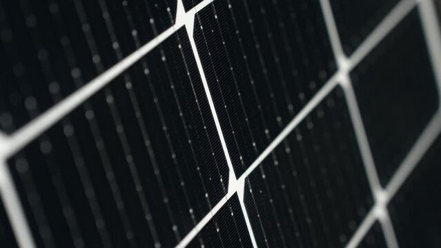 Macro detail closeup of black high efficiency Solar Panelcells, rising tilt