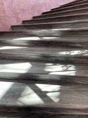 Spiral marble stairs with interesting shadows