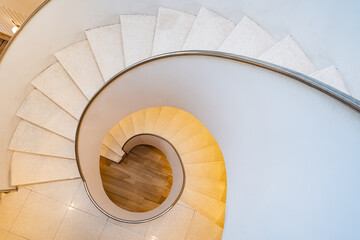 Spiral staircase, Top view indoor modern white spiral staircase and sunlight.