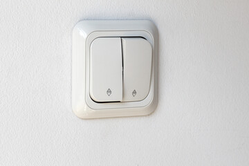 White electricity switch button for indoor use, side view