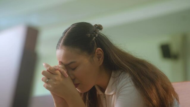 Portrait Of Young Woman Praying Inside The Chapel. Closeup