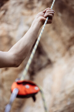 Hand holding a rock climbing rope