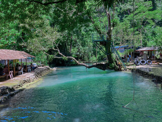 Beautiful Blue Lagoon waters in Vang Vieng Laos. Surrounded by beautiful mountains and trees