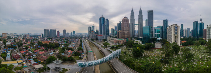 High angle view of sunrise at Kuala Lumpur city skyline with Petronas Twin Towers from Traders Hotel