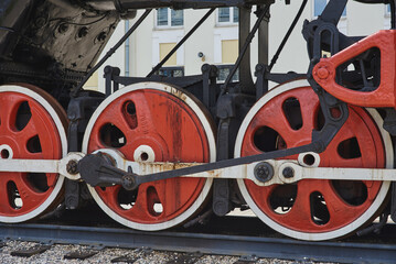 Steel wheels of a Soviet retro steam locomotive .