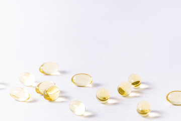 Omega 3 cod liver oil capsules on white background with copy space for your design. Health care concept.