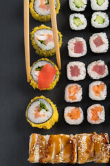 big set of delicious rolls with white rice, top view