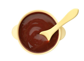 Bowl and spoon with tasty pureed baby food isolated on white, top view