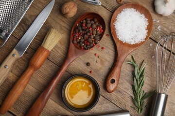 Flat lay composition with cooking utensils and ingredients on wooden table