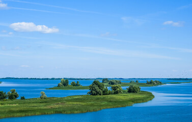 Obraz premium The Volga River, Russia. Tourist steamer floating on the Volga river channel, view from the quadcopter
