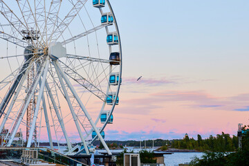 helsinki ferrish wheel for tourism and amusement in finland during summer evening sunset with a...
