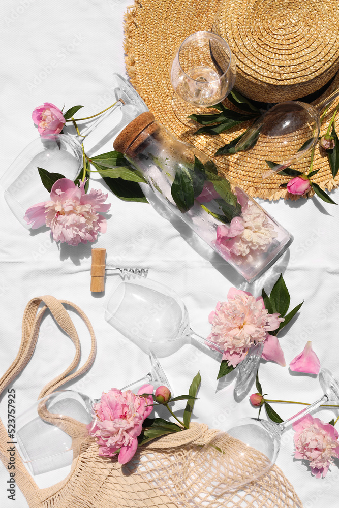 Canvas Prints Flat lay composition with beautiful peonies and wineglasses on white fabric