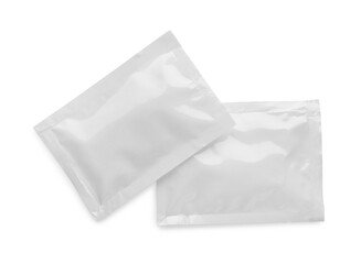 Blank sachets with wet wipes on white background, top view. Space for design - obrazy, fototapety, plakaty
