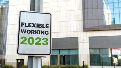 Flexible working 2023 sign in a downtown city setting	
