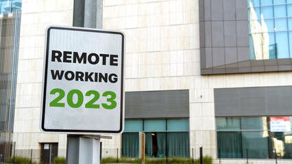 Remote Working 2023 sign in a downtown city setting	
