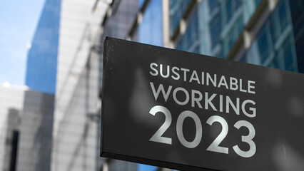 Sustainable Working 2023 on a sign outside a modern office building	
