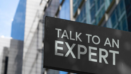 Talk to an expert on a sign outside a modern office building	
