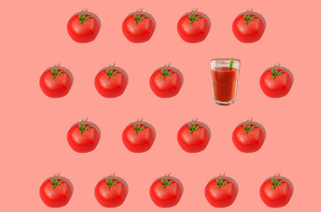Pattern. Red tomatoes and one glass of tomato juice on a pink background. Concept of healthy eating. Horizontal orientation.