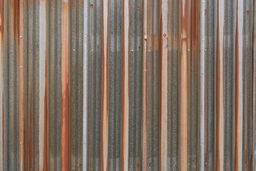 Rusty metal corrugated fence wall border, grunge old zig zag pressed formed fencing