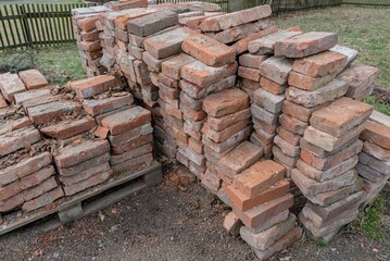 Vintage old grunge Stacked bricks pile stack heap, construction building debris rubble waste material