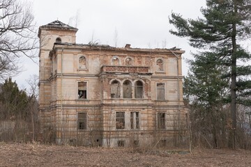 Historic old Early 20th century brick ruined derelict abandoned house villa building facade
