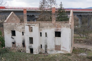 Historic old Early 20th century brick ruined derelict abandoned house villa building facade