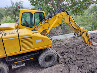 an excavator is stationed in an area where work is taking place