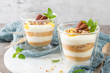 Natas do Ceu is a traditional Portuguese dessert made with cream, eggs and biscuits decorated with pecan nuts and mint leaves