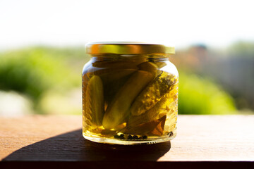 pickled cucumbers in a glass jar