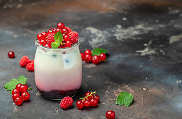 berries Yogurt. Healthy layered dessert with yogurt, jam, red currant and raspberries. Natural detox. banner, menu, recipe place for text, top view