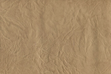 Brown bright macro photo of texture of the genuine faux vegan leather. Fashion pattern and background. Leather with embossing.