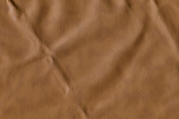 Brown bright macro photo of texture of the genuine faux vegan leather. Fashion pattern and...