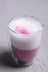Pink matcha latte with milk close up