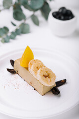 Delicious banana chocolate cake on white plate