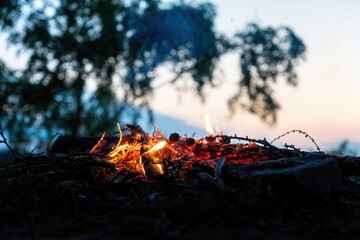 Campfire on a cliff by the rock