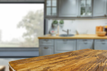 Wooden desk of free space and kitchen interior 