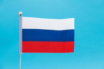 Russia flag waving on blue background