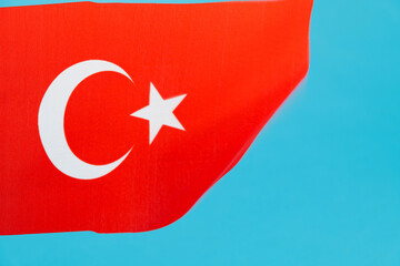 Turkish flag waving on blue background