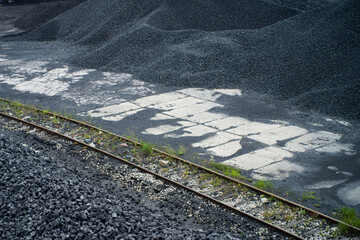 Fototapeta premium tons of coal on coal halds in storage in a coal mine