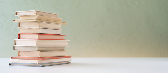 Pile of miniature vintage books.