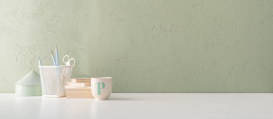 Home office desk with dark green wall and white table mock up.	