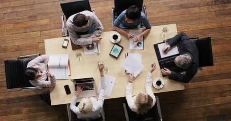 Busy business people planning, organizing and idea sharing in meeting, working together on finance chart or data for growth, innovation and development. Above of professional budget team on a mission - Powered by Adobe