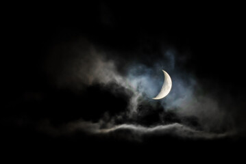 Night sky. Night moon in the clouds.